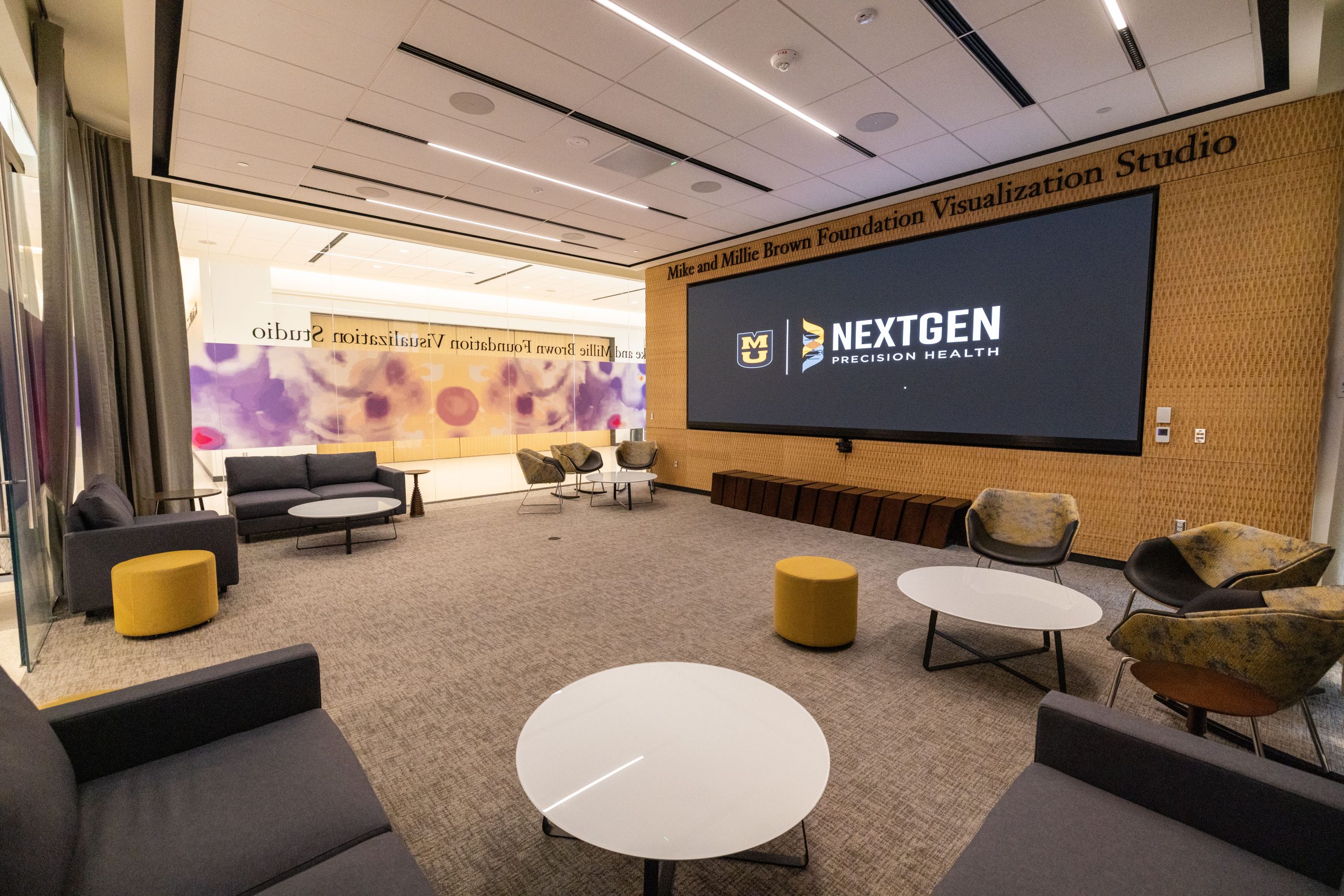 Brown Visualization Studio with seating and a large screen