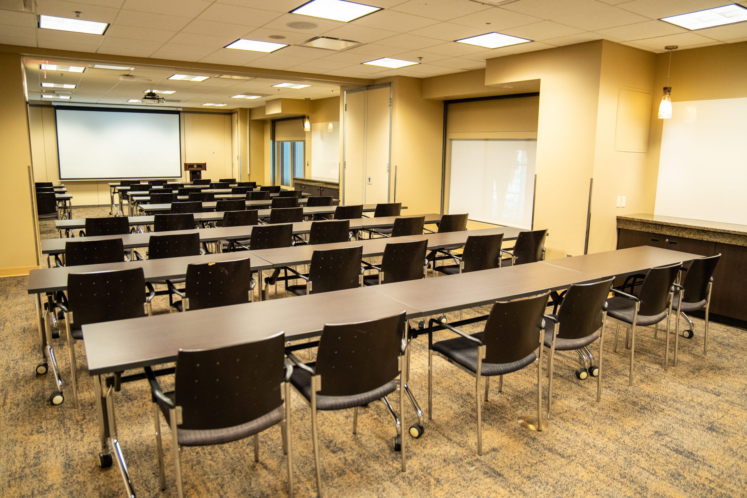 Meeting room with desks, chairs and projector