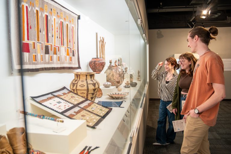 People admire art at the Museum of Art and Archaeology