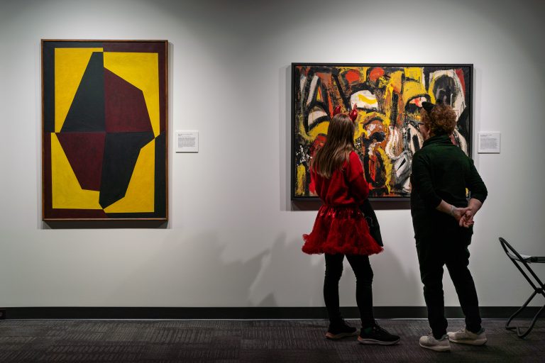 People admire art at the Museum of Art and Archaeology