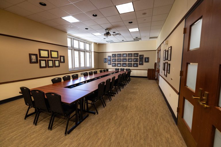 Meeting room space with long table and chairs